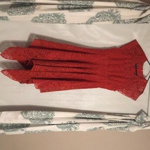 Red asymmetrical eyelet dress